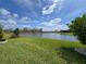 Expansive backyard with stunning lake views, perfect for relaxing or entertaining guests at 18743 Coastal Shore Ter, Land O Lakes, FL 34638