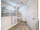 Bright bathroom featuring a glass shower, stone flooring, double towels, and a built in shower bench at 18743 Coastal Shore Ter, Land O Lakes, FL 34638