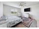 Cozy bedroom with a large window and a stylish rug at 18743 Coastal Shore Ter, Land O Lakes, FL 34638