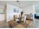 Cozy dining room with a glass table, comfortable chairs, and elegant decor, perfect for intimate meals at 18743 Coastal Shore Ter, Land O Lakes, FL 34638
