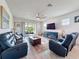 Bright living room with sliding glass doors leading to an outdoor patio and a beautiful view at 18743 Coastal Shore Ter, Land O Lakes, FL 34638