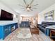Comfortable living room featuring a large TV, plush seating, and stylish decor, ideal for relaxation at 18743 Coastal Shore Ter, Land O Lakes, FL 34638