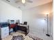 Functional home office space featuring a ceiling fan, modern desk, and essential equipment at 18743 Coastal Shore Ter, Land O Lakes, FL 34638