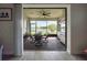 Enjoy indoor/outdoor living with this screened-in patio featuring a dining set and outdoor kitchen at 18743 Coastal Shore Ter, Land O Lakes, FL 34638