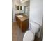 Bathroom featuring a single sink vanity and tile floors at 4249 Hawksley Pl, Wesley Chapel, FL 33545