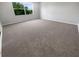 Bright and airy bedroom with neutral carpet and a large window offering a pleasant view at 4249 Hawksley Pl, Wesley Chapel, FL 33545