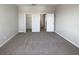 Neutral bedroom with carpet, featuring walk-in closet and doorway access at 4249 Hawksley Pl, Wesley Chapel, FL 33545