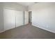 Bedroom with carpet, large closets and adjacent access to additional rooms at 4249 Hawksley Pl, Wesley Chapel, FL 33545