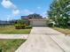 Charming single-Gathering home with a well-maintained lawn and a convenient two-car garage and large driveway at 4249 Hawksley Pl, Wesley Chapel, FL 33545