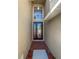 Inviting entryway with brick floor tiles and decorative glass front door with sidelight at 4249 Hawksley Pl, Wesley Chapel, FL 33545