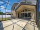 Covered lanai features screen enclosure with backyard views and sliders leading inside at 4249 Hawksley Pl, Wesley Chapel, FL 33545