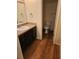 Bathroom with vanity and wood look floor at 12627 W Cherrydale Ln, Hudson, FL 34669