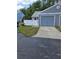 Charming home featuring a one-car garage, a well-maintained lawn, and a privacy fence at 12627 W Cherrydale Ln, Hudson, FL 34669