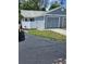 Charming home featuring a one-car garage, a well-maintained lawn, and a privacy fence at 12627 W Cherrydale Ln, Hudson, FL 34669