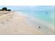 Scenic view of the beach with white sand and clear water on a sunny day at 201 Chardin Dr, Nokomis, FL 34275