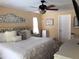 Comfortable bedroom with ceiling fan offers a relaxing retreat at 201 Chardin Dr, Nokomis, FL 34275