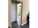 View of the bedroom with wood flooring, green walls, and a ceiling fan at 201 Chardin Dr, Nokomis, FL 34275
