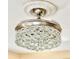 Elegant ceiling fan with crystal accents, mounted on a decorative ceiling medallion at 201 Chardin Dr, Nokomis, FL 34275