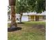 Well-maintained home with a large front yard and mature trees and landscaping at 201 Chardin Dr, Nokomis, FL 34275