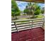 Enjoy the view from this balcony with a painted wooden floor and bright white railing at 22620 Gage Loop # 25, Land O Lakes, FL 34639