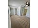 Spacious bedroom with a ceiling fan and closets at 22620 Gage Loop # 25, Land O Lakes, FL 34639