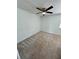 Empty bedroom featuring a ceiling fan and neutral carpet at 22620 Gage Loop # 25, Land O Lakes, FL 34639