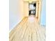 Hallway with modern floors leading to kitchen at 22620 Gage Loop # 25, Land O Lakes, FL 34639