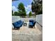A large, light stone patio area with dark outdoor seating perfect for enjoying the outdoors at 22620 Gage Loop # 25, Land O Lakes, FL 34639