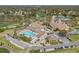 An aerial shot featuring community amenities including pool, golf course, clubhouse and parking at 2436 Deer Trail Ln, Spring Hill, FL 34606