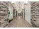 Inviting hallway with stone accents and vaulted ceilings, adding architectural interest at 2436 Deer Trail Ln, Spring Hill, FL 34606