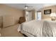 Bedroom featuring carpet, ceiling fan, and en-suite bathroom entrance at 2436 Deer Trail Ln, Spring Hill, FL 34606