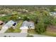 An aerial view highlighting the home's prime location near the golf course and lush greenery at 2444 Grandfather Mtn, Spring Hill, FL 34606