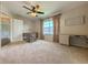 Bedroom with a ceiling fan, a closet, built-in desk space, and neutral carpet at 2444 Grandfather Mtn, Spring Hill, FL 34606