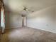 Large bedroom featuring neutral carpeting and a ceiling fan at 2444 Grandfather Mtn, Spring Hill, FL 34606