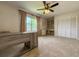 Bedroom featuring built-in desk space, a closet, and a ceiling fan at 2444 Grandfather Mtn, Spring Hill, FL 34606