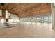 A bright, expansive event space with hardwood floors and arched windows at 2444 Grandfather Mtn, Spring Hill, FL 34606