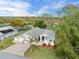 An aerial view of the home showing its location on a well-manicured street and proximity to the golf course at 2444 Grandfather Mtn, Spring Hill, FL 34606