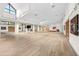 Bright, spacious fitness studio with wood-look floors, shelving and large windows at 2444 Grandfather Mtn, Spring Hill, FL 34606