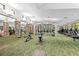 Well-lit gym with a variety of exercise equipment, columns, and large windows at 2444 Grandfather Mtn, Spring Hill, FL 34606