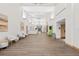 Bright hallway featuring contemporary design, light wood floors, and modern lighting at 2444 Grandfather Mtn, Spring Hill, FL 34606