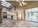 Modern kitchen featuring stainless steel appliances, white cabinets, and stone countertops at 2444 Grandfather Mtn, Spring Hill, FL 34606