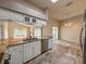 Bright kitchen with granite countertops, stainless steel appliances, and an open design at 2444 Grandfather Mtn, Spring Hill, FL 34606