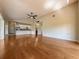 Expansive living area showcases hardwood floors and an open floor plan into the kitchen at 2444 Grandfather Mtn, Spring Hill, FL 34606
