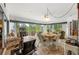 Sunroom with tile flooring, exercise equipment, and abundant seating at 2444 Grandfather Mtn, Spring Hill, FL 34606