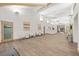 Spacious lobby area with modern seating, artwork, and light wood-look flooring at 2444 Grandfather Mtn, Spring Hill, FL 34606