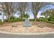 Patriotic memorial area featuring brick paving, benches, and commemorative stone amidst a serene, tree-lined setting at 2444 Grandfather Mtn, Spring Hill, FL 34606