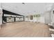 Large studio space with mirrors, wood-look floors, and bright lighting at 2444 Grandfather Mtn, Spring Hill, FL 34606