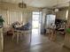 Bright dining area featuring laminate floors, a dining table, and an abundance of natural light at 34315 Timberland Blvd, Wesley Chapel, FL 33543