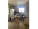 Kitchen featuring laminate floors, white appliances, and plenty of natural light at 34315 Timberland Blvd, Wesley Chapel, FL 33543