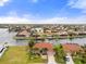 Overhead view of a waterfront home and neighborhood with scenic canals and lush landscaping at 3629 Licata Ct, Punta Gorda, FL 33950